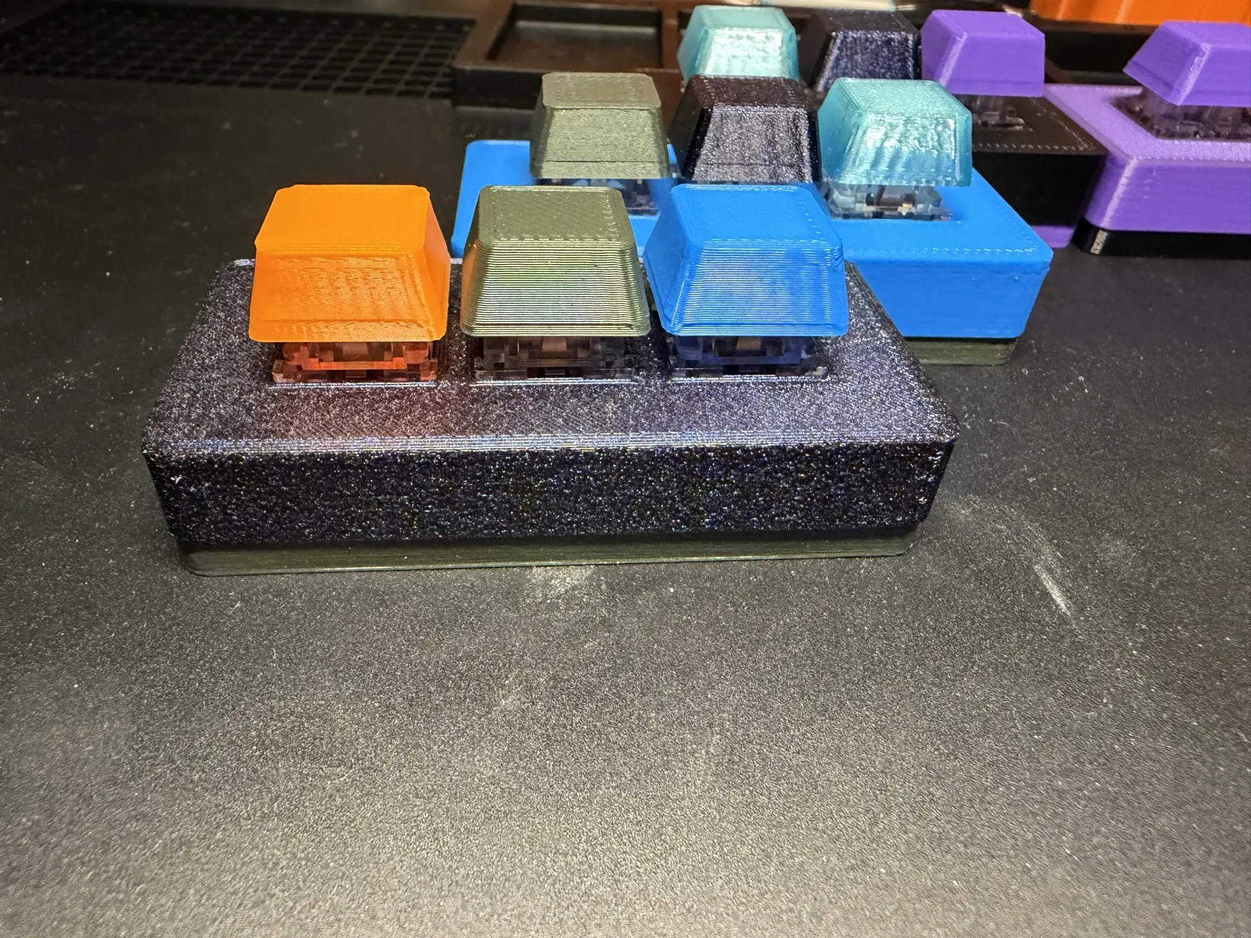 Finished three-key Passive Clacky with orange, green, and blue 3D-printed low-profile keycaps