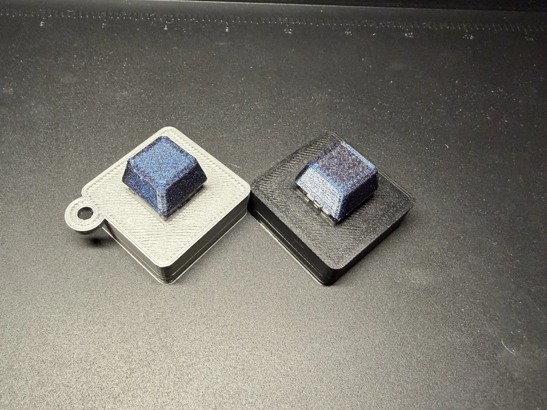 Angled view of one-key Clacky models with and without the optional keychain loop
